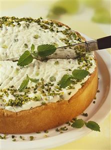 Kiwi fruit yoghurt cake with pistachios and lemon balm