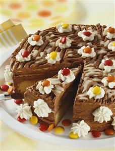 Chocolate cake with cream and coloured chocolate beans