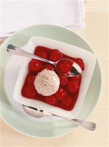 Cherries in port wine sauce with nut ice cream