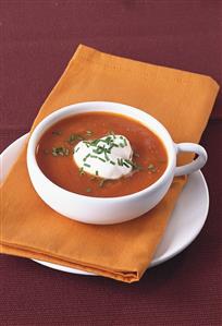 Creamed tomato soup with cream and chives