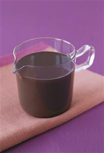 Chocolate sauce in glass jug