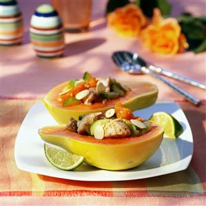 Papaya half stuffed with mackerel, cucumber & cherry tomato