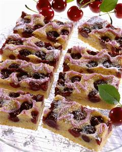 Tray-baked cherry cake with pink icing