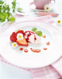 Spoonfuls of strawberry quark with strawberry sauce & flowers