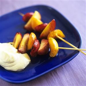 Grilled fruit kebabs with whipped cream