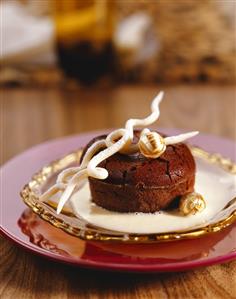 Chocolate soufflé with white chocolate sauce