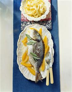 Stuffed sea bream with sage on orange sauce