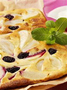 Baked fruit omelette and a small bowl of quark with honey