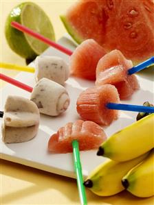 Watermelon sorbet and banana ice cream on sticks