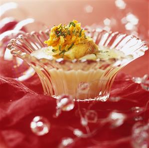 Fish soup in a glass bowl, with festive decorations