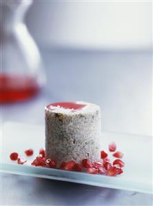 Rice mould with poppy seeds and pomegranate seeds