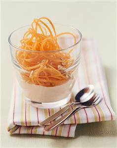 Carrot spaghetti with yoghurt and nuts