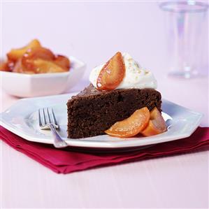 A piece of chocolate cake with peach compote