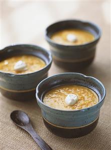 Three bowls of pumpkin soup