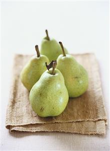 Four pears on a cloth