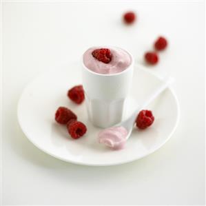 Raspberry yoghurt and fresh raspberries