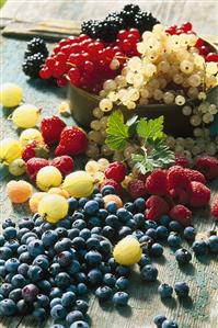 Mixed berries on wooden background