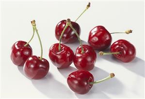 Several cherries on white background