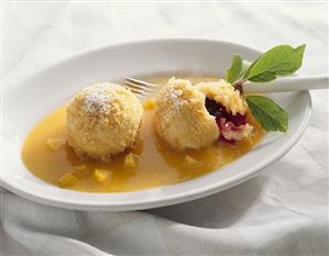 Plum dumplings with fruit sauce