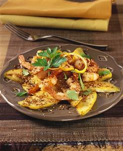 Shrimps on fried mango with lemon