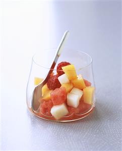 Chilled vodka with melon and raspberry salad