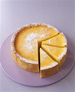 An orange and lime cheesecake, pieces cut