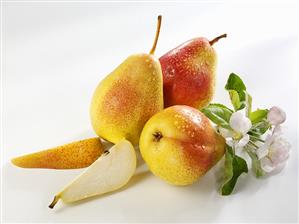 Three pears and two pear wedges (variety ?Forelle?)