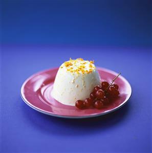 Orange panna cotta with redcurrants