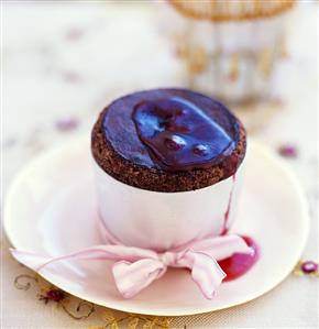 Chocolate soufflé with hot raspberry sauce