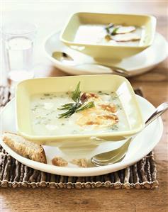 Cheese soup with fried potato crisps and bread