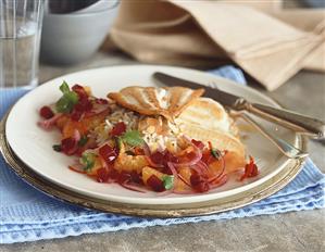 Fried fish fillet on rice with orange and beetroot salad