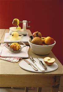 Implements for peeling, coring and slicing apples