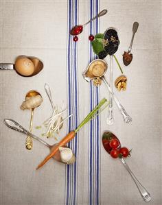 Spoons with fruit, vegetables and spices