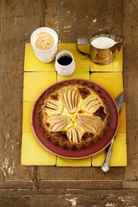 Apple cake on a plate with black coffee and milky coffee