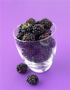 Fresh blackberries in a glass