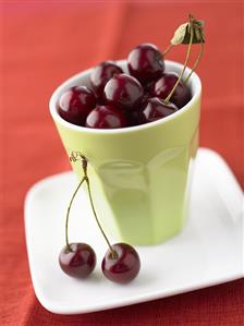 Cherries in a pottery beaker