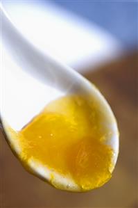 Apricot jam on a spoon