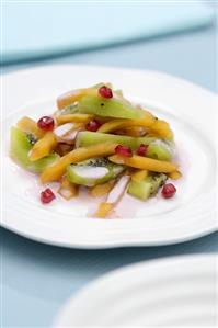 Fruit salad with pomegranate, Sharon fruit and kiwi fruit