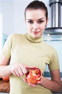 Woman peeling an apple