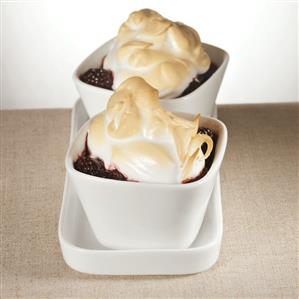 Baked blackberries with meringue topping in small bowls