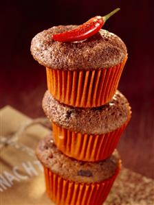 Three chocolate chilli muffins with a chilli