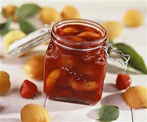 Strawberry and apricot jam in a jar