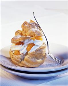 Profiterole with cream and mandarin oranges