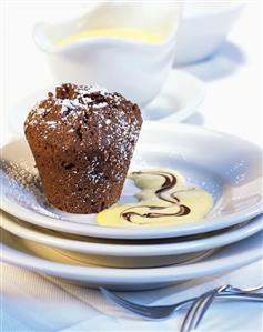 Small chocolate pudding with custard