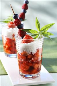 Strawberry soup with grated coconut and skewered berries