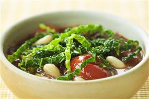 Savoy cabbage stew with beans and tomatoes