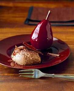 Chocolate mousse with pear in elderberry sauce