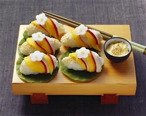 Nigiri sushi with chicken and mango