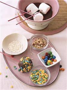 Chocolate fondue with marshmallows and decorations