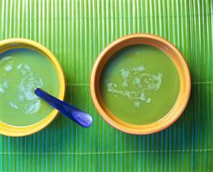 Two bowls of cream pea soup